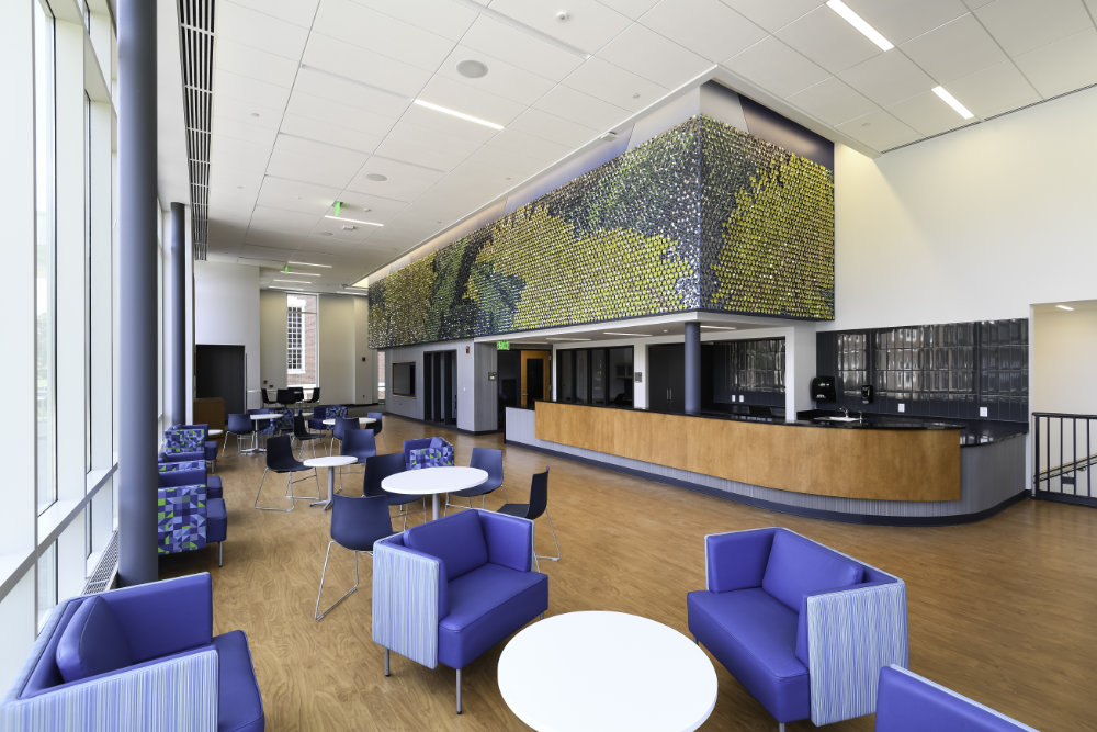 Angled view of dandelion mosaic mural in the Sloan Center lobby area.
